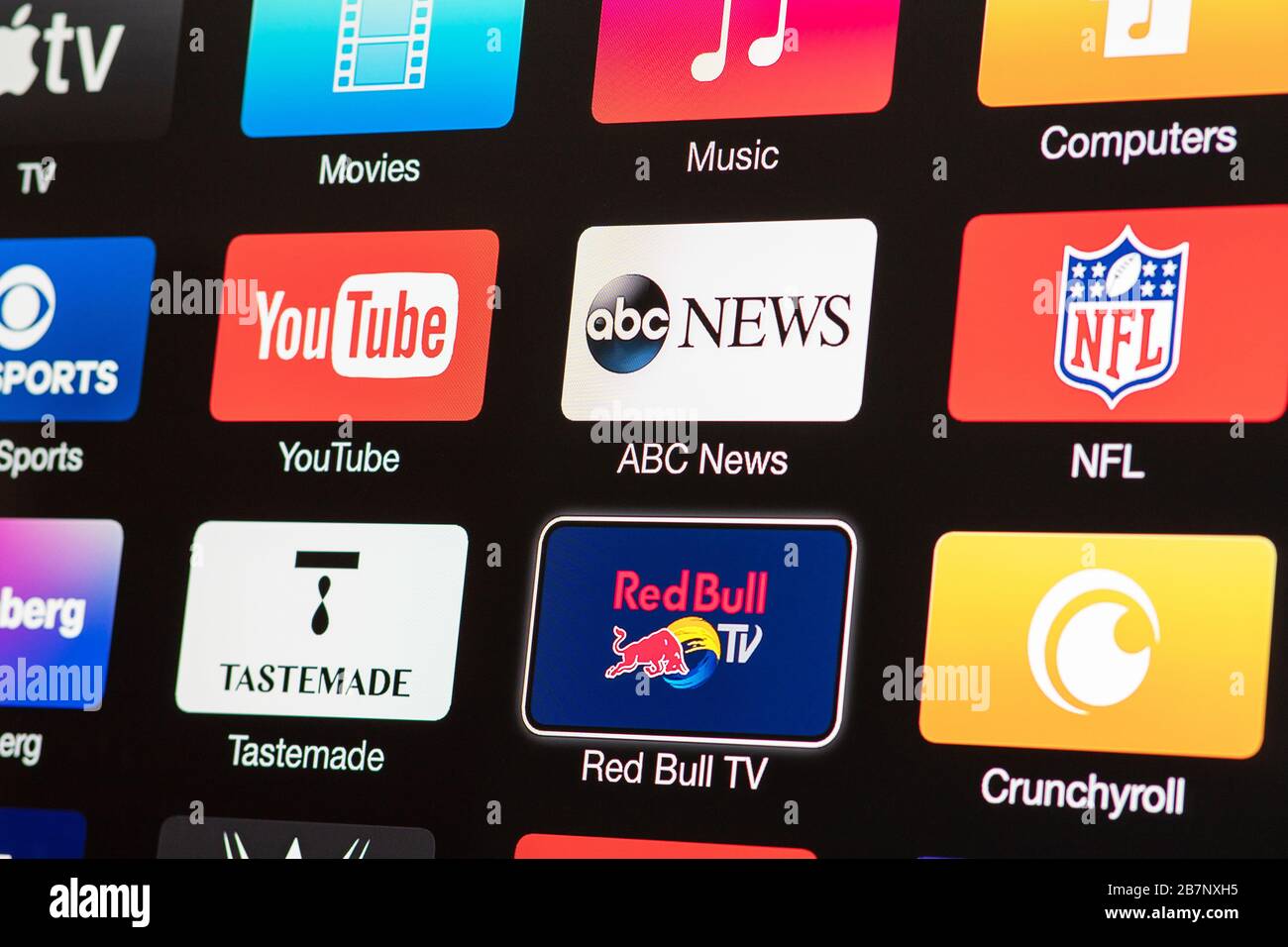 Smart TV with icons of video streaming services and apps YouTube, ABC News, Tastemade, UFC, NFL, Crunchyroll, Flickr and Red Bull TV Stock Photo 