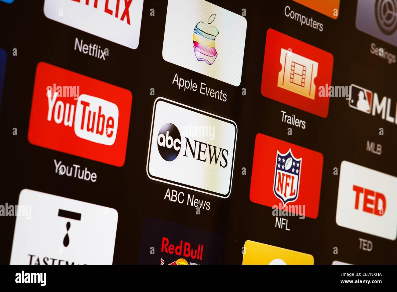 Smart TV with icons of video streaming services and apps YouTube, ABC News, Tastemade, UFC, NFL, Crunchyroll, Flickr and Red Bull TV Stock Photo 