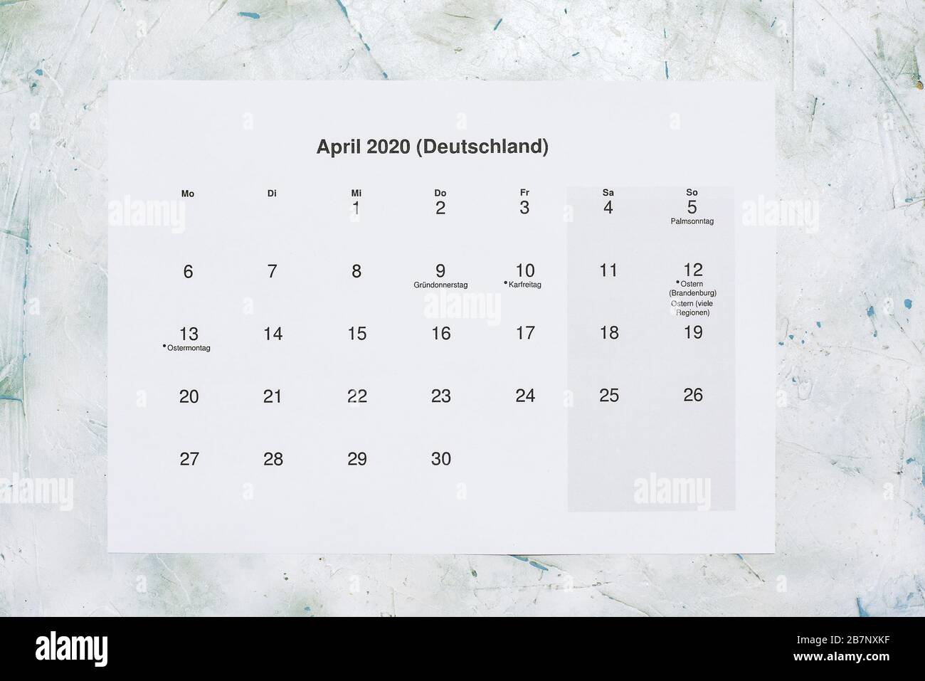 Monatskalender April 2020. Translation: Monthly April 2020 calendar. Paper April month calendar in Dutch. Top view Stock Photo