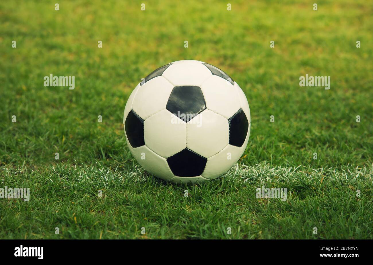 Classic soccer ball, typical black and white hexagon pattern, placed on