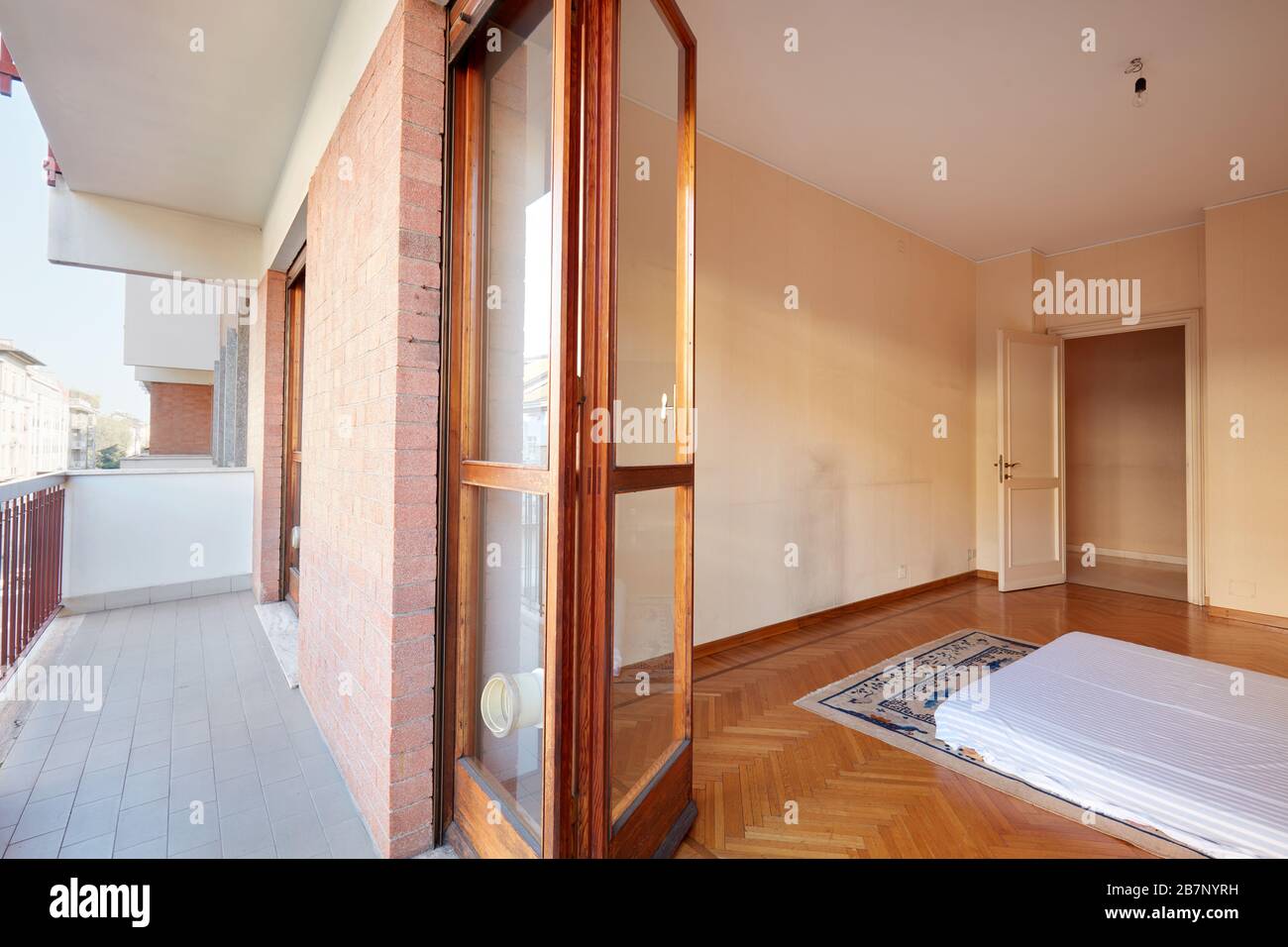 Bedroom with tatami bed and balcony in apartment Stock Photo