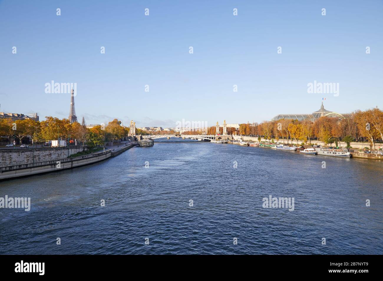 Seine river view with Eiffel tower and Alexander III bridge wide angle view in a sunny autumn day in Paris Stock Photo