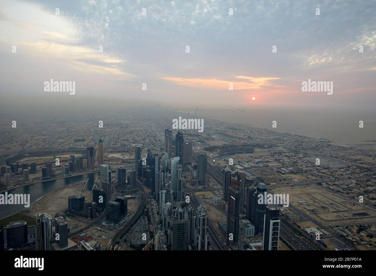 DUBAI, UNITED ARAB EMIRATES - NOVEMBER 19, 2019: Dubai city high angle view with skyscrapers at sunset, cloudy sky in the evening Stock Photo