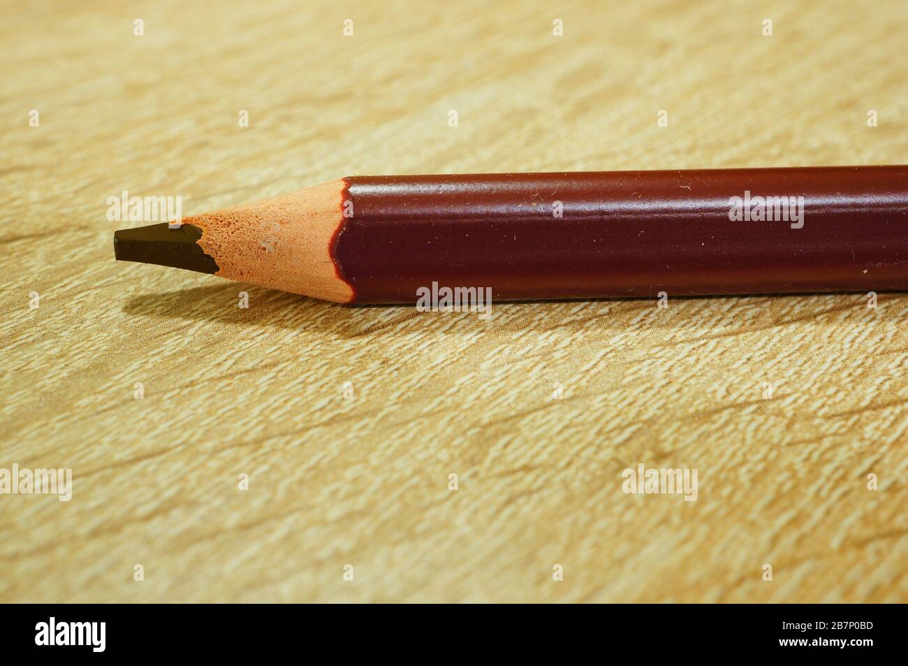 Closeup shot of a colored pencil on a wooden surface Stock Photo