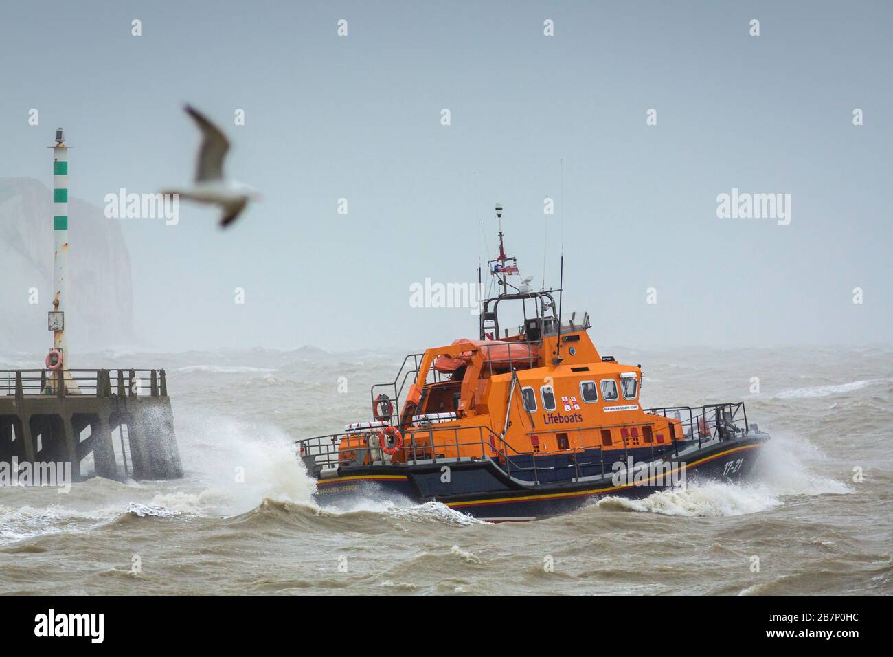 The RNLI Severn Class lifeboat RNLB David and Elizabeth Acland heads into heavy seas as the crew leaves Newhaven, East Sussex during Storm Ciara today Stock Photo