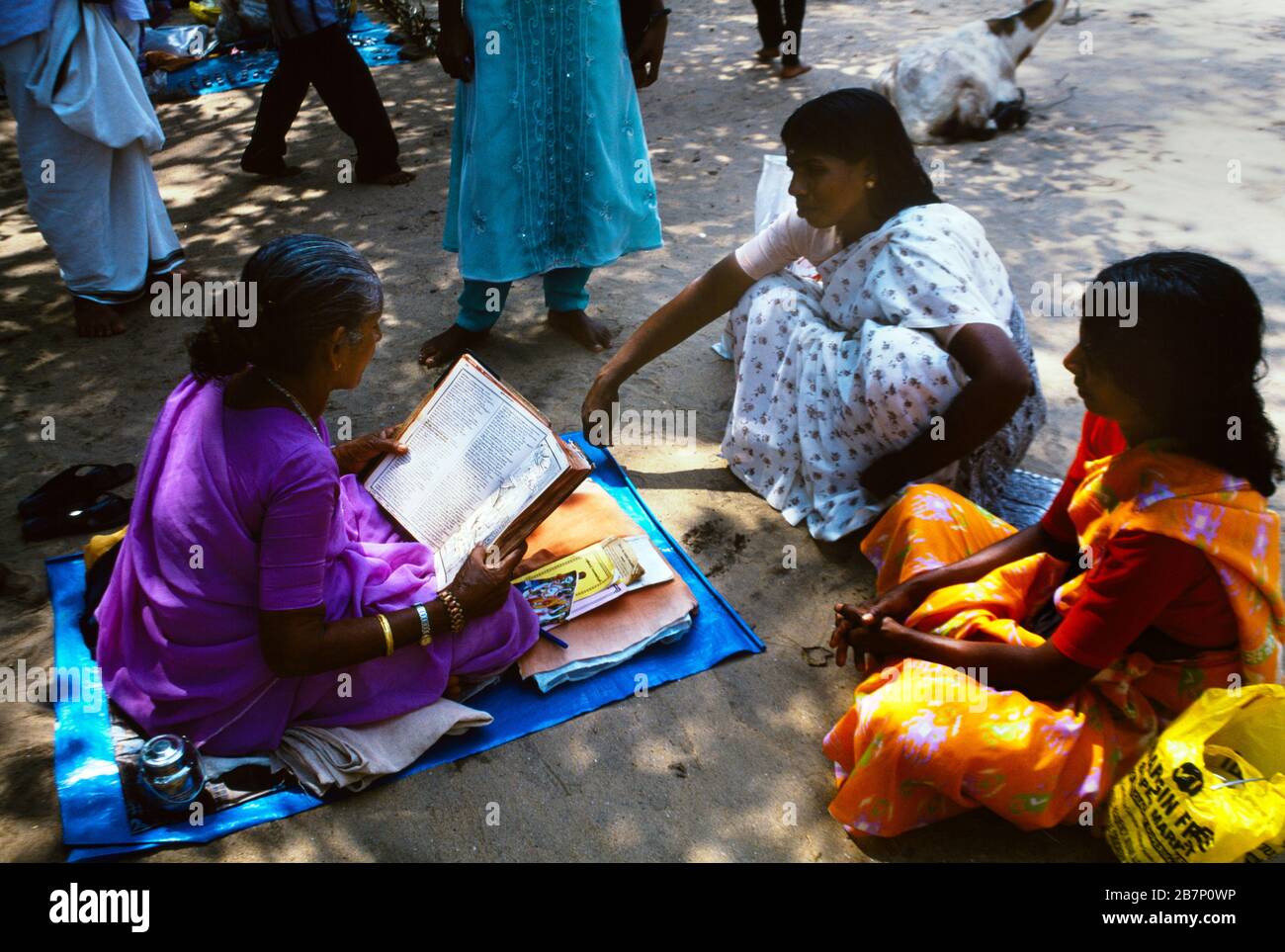 Kerala India Woman Reading Holy Book at Shiva Temple Stock Photo