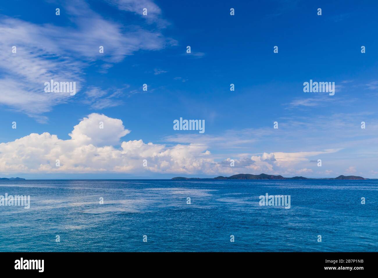 Blue sky with white cloud and deep blue sea Stock Photo - Alamy