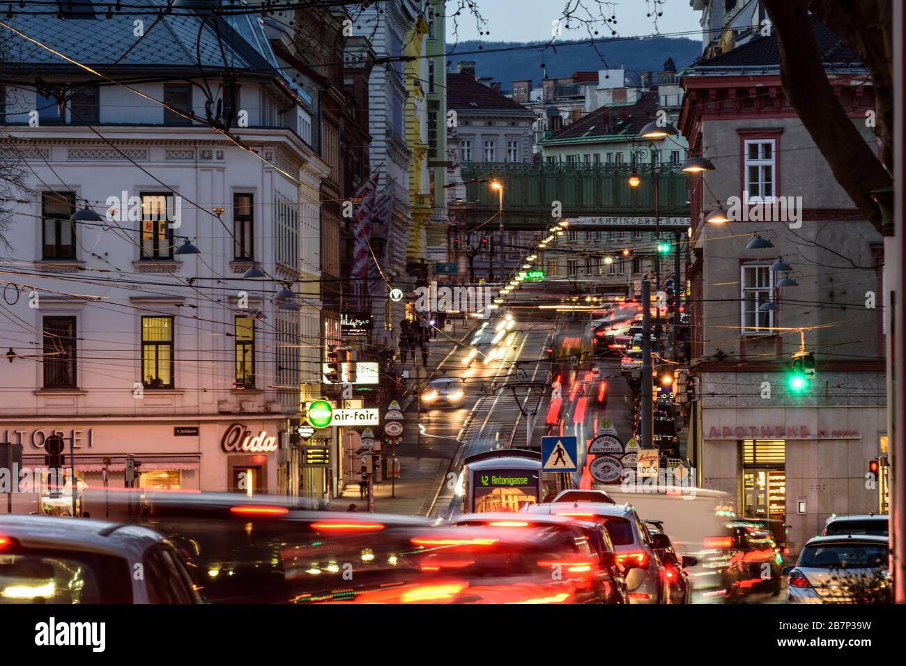 Wien, Vienna: streetcar, cars, car light trails, heavy traffic, rush hour, street Währinger Straße, in 09. Alsergrund, Wien, Austria Stock Photo