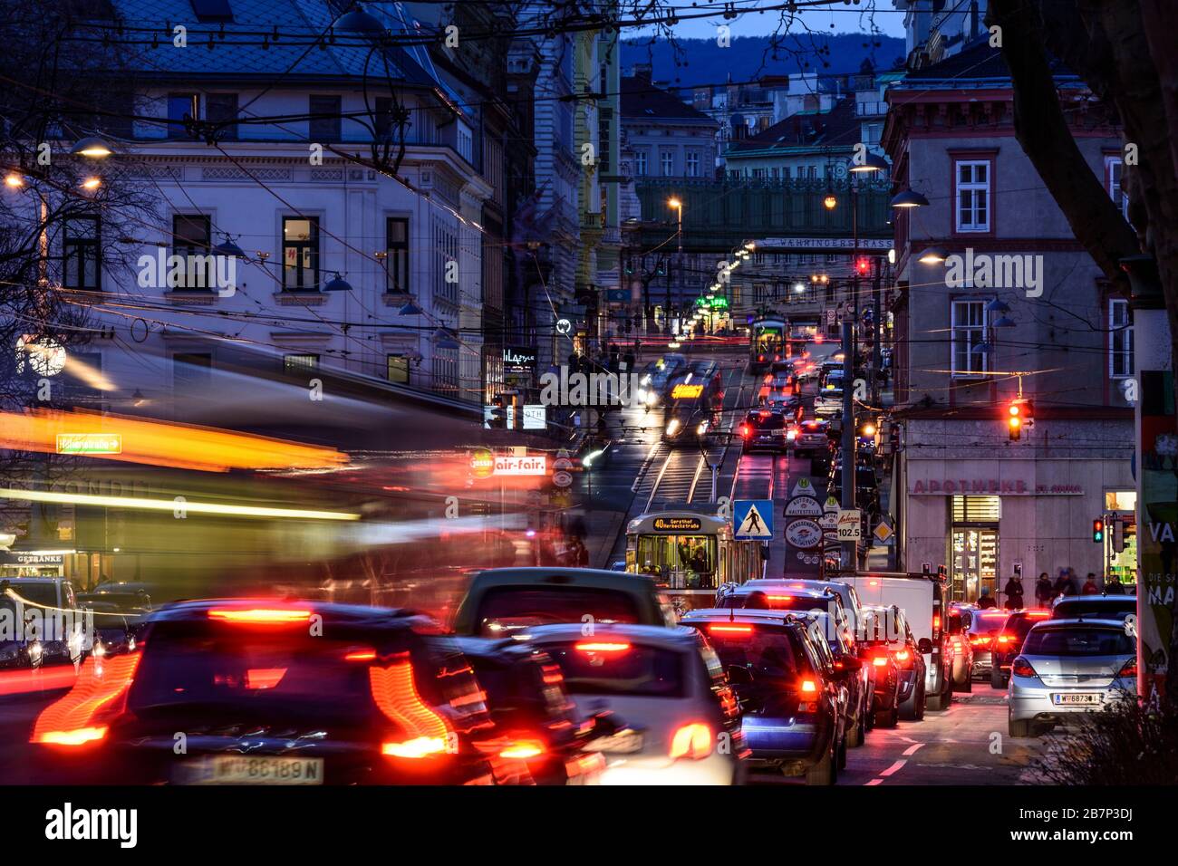 Wien, Vienna: streetcar, cars, car light trails, heavy traffic, rush hour, street Währinger Straße, in 09. Alsergrund, Wien, Austria Stock Photo