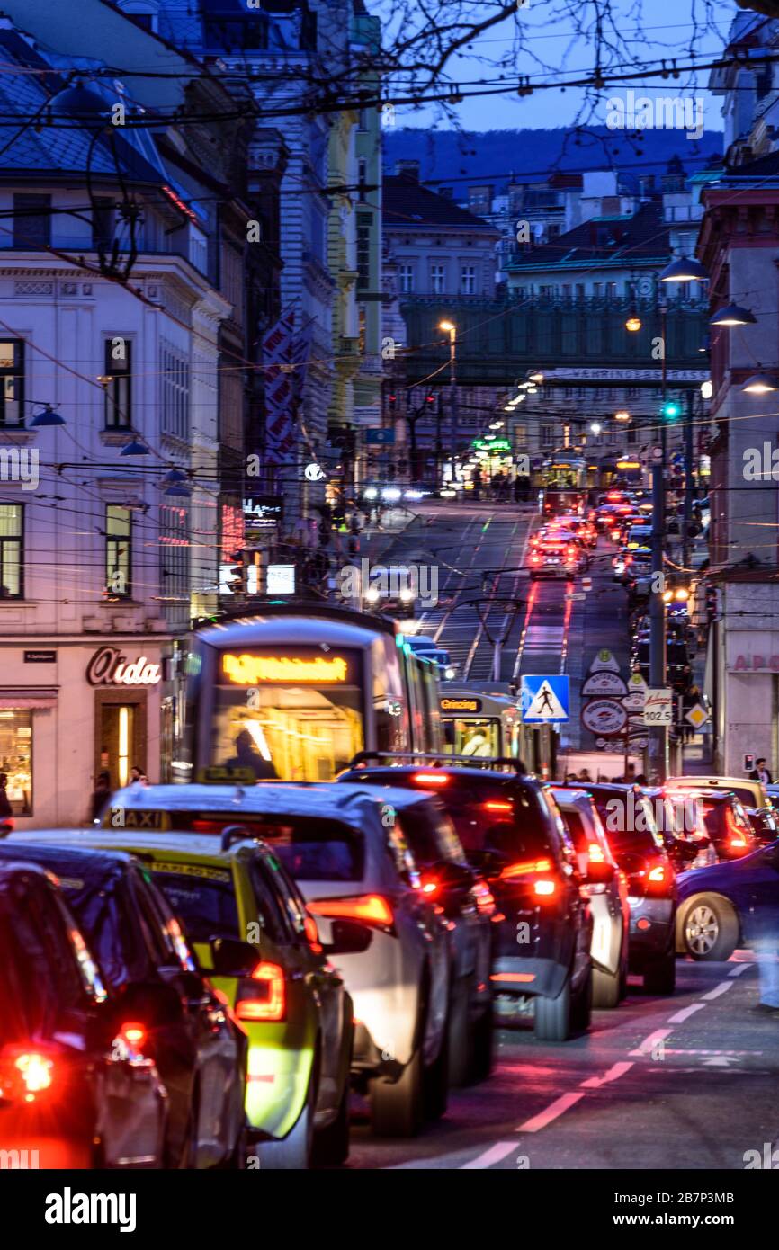 Wien, Vienna: streetcar, cars, car light trails, heavy traffic, rush hour, street Währinger Straße, in 09. Alsergrund, Wien, Austria Stock Photo