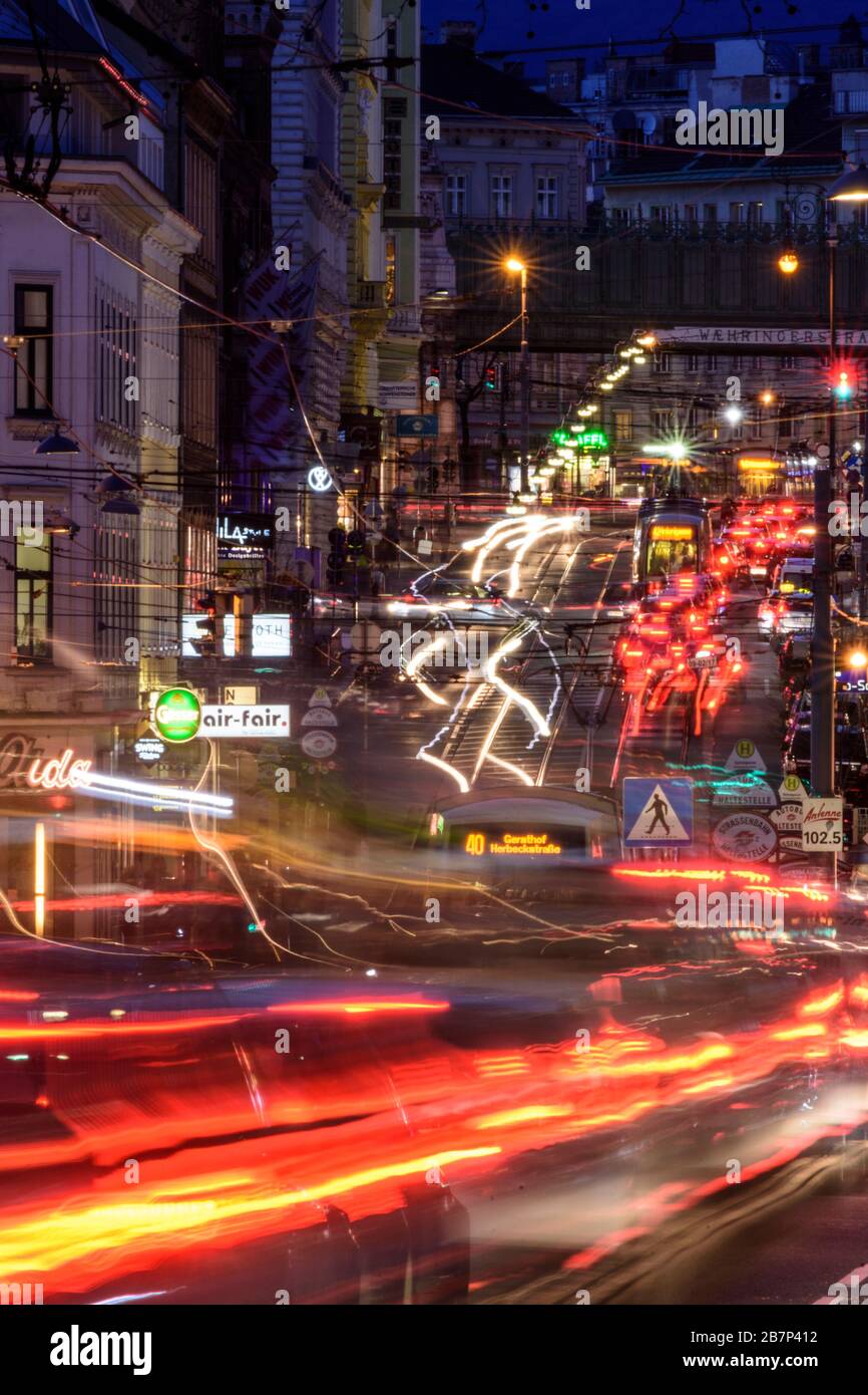 Wien, Vienna: streetcar, cars, car light trails, heavy traffic, rush hour, street Währinger Straße, in 09. Alsergrund, Wien, Austria Stock Photo