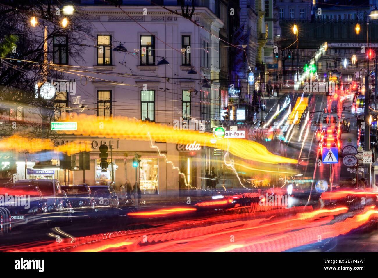 Wien, Vienna: streetcar, cars, car light trails, heavy traffic, rush hour, street Währinger Straße, in 09. Alsergrund, Wien, Austria Stock Photo