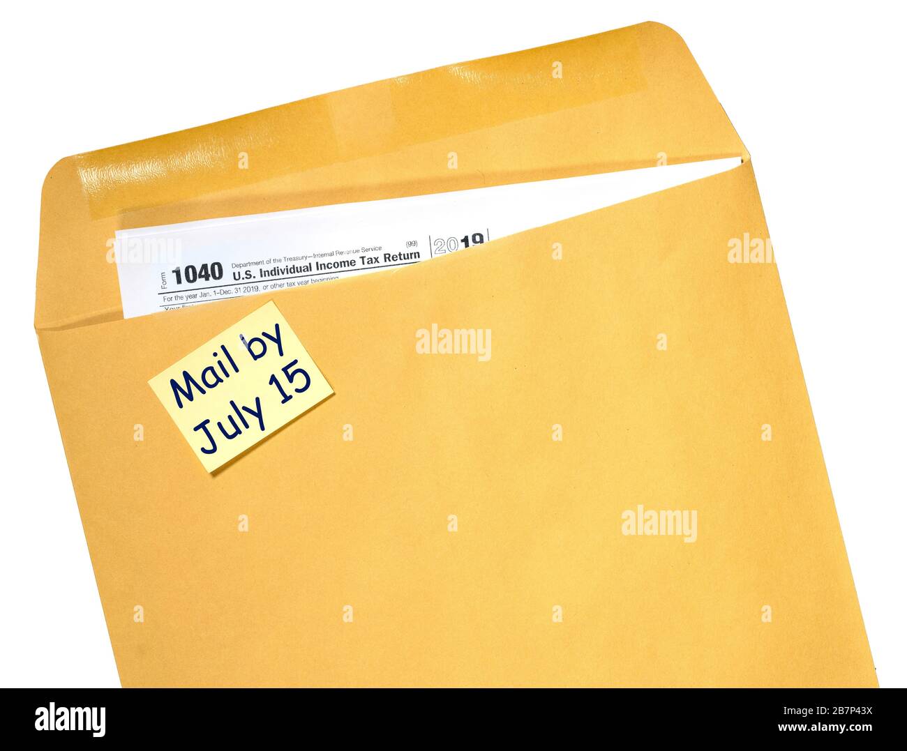 Printed Form 1040 for income tax return in brown envelope with reminder for July 15 tax day due to Covid-19 virus delay Stock Photo