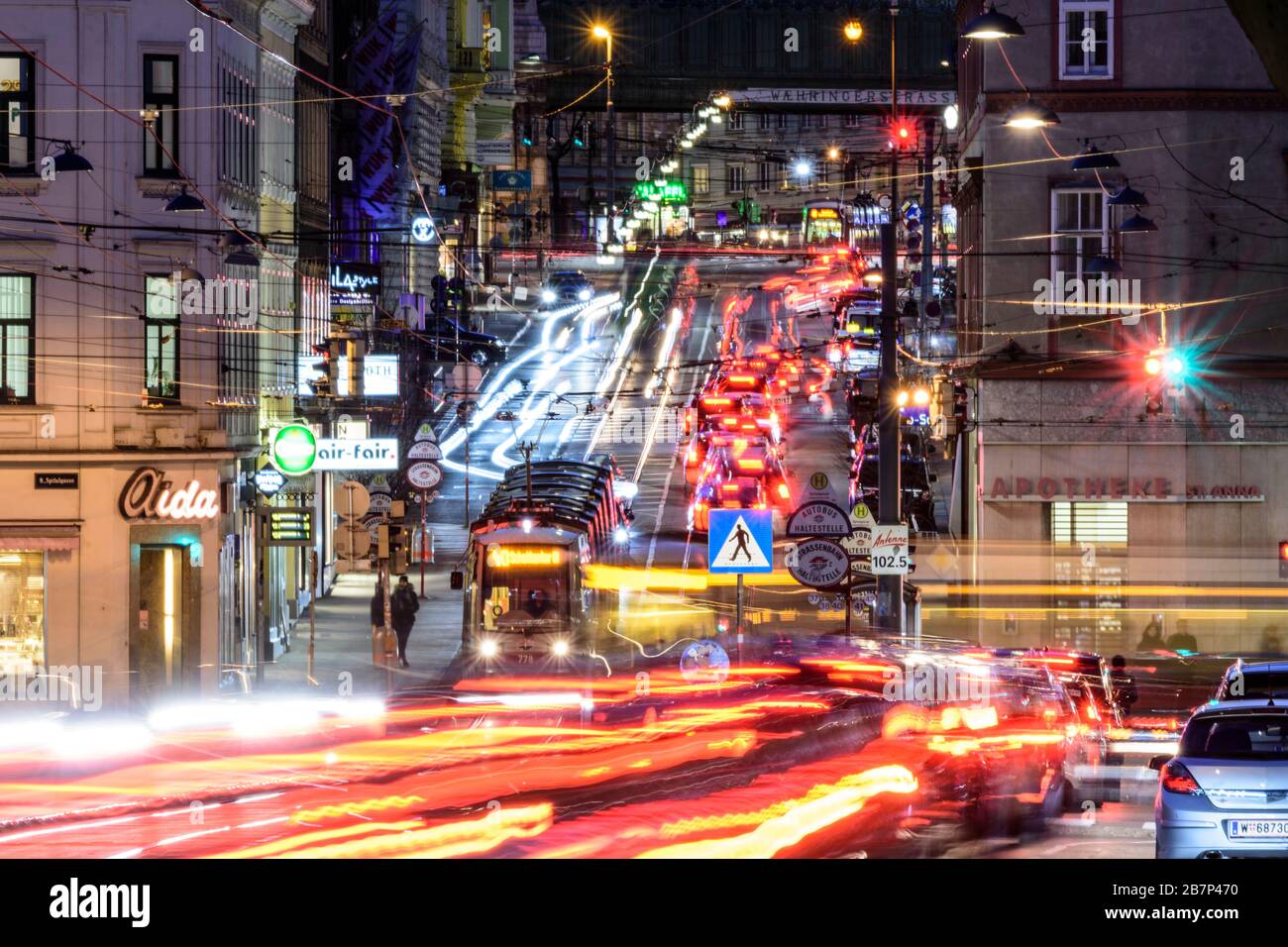 Wien, Vienna: streetcar, cars, car light trails, heavy traffic, rush hour, street Währinger Straße, in 09. Alsergrund, Wien, Austria Stock Photo