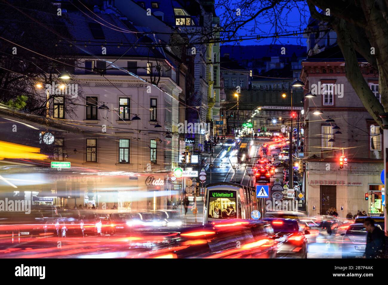 Wien, Vienna: streetcar, cars, car light trails, heavy traffic, rush hour, street Währinger Straße, in 09. Alsergrund, Wien, Austria Stock Photo