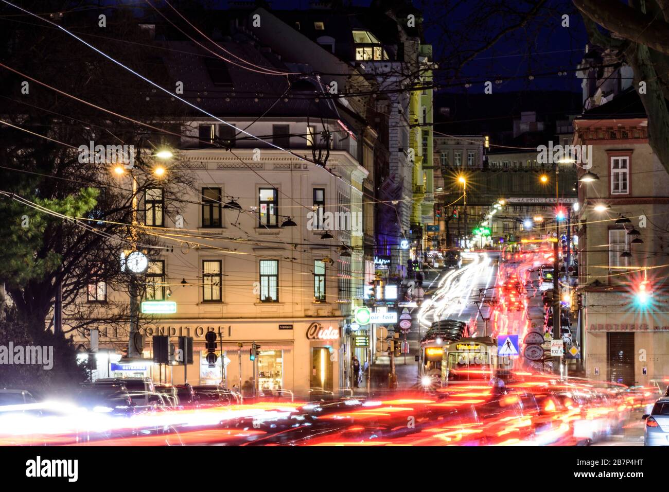 Wien, Vienna: streetcar, cars, car light trails, heavy traffic, rush hour, street Währinger Straße, in 09. Alsergrund, Wien, Austria Stock Photo