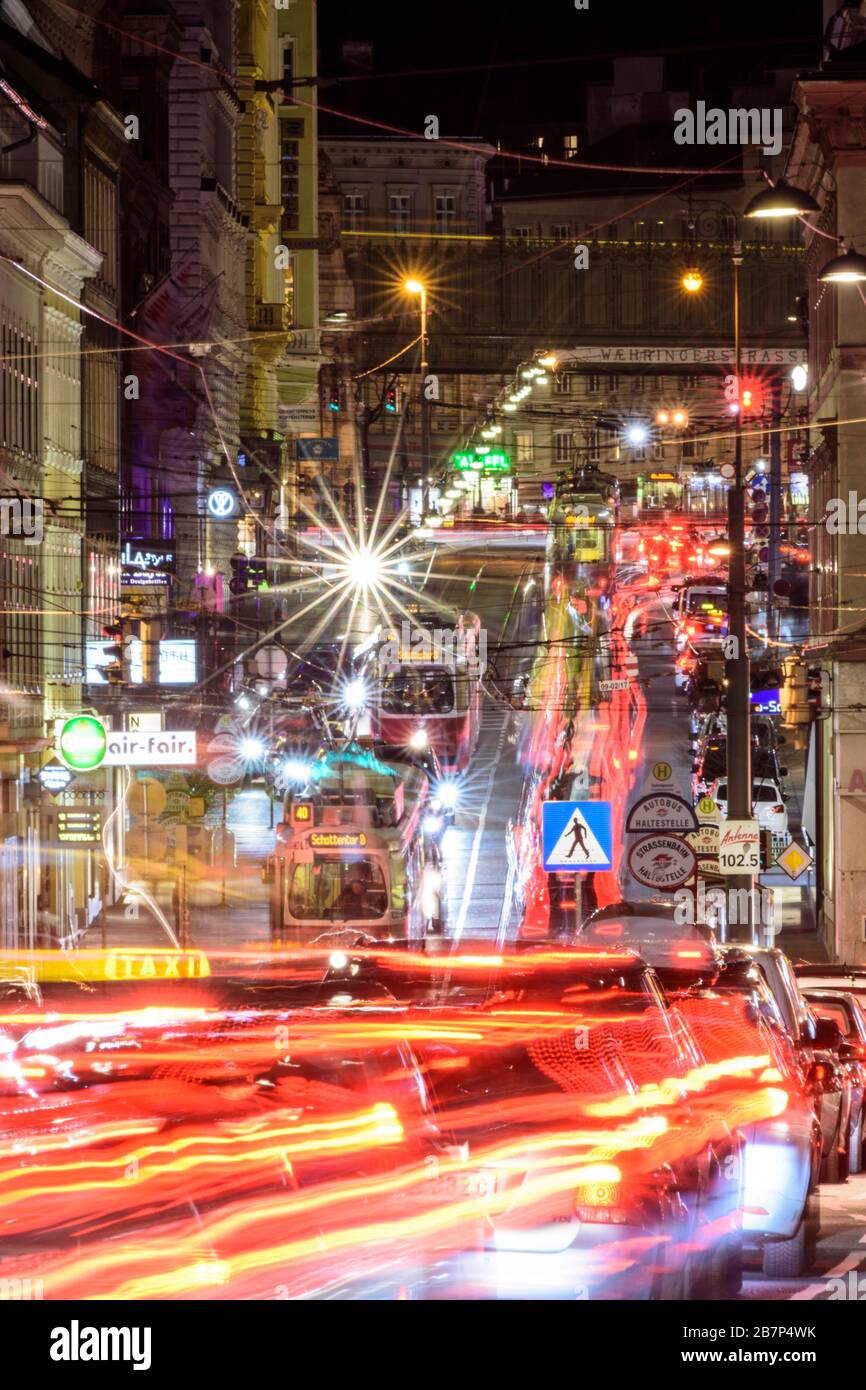 Wien, Vienna: streetcar, cars, car light trails, heavy traffic, rush hour, street Währinger Straße, in 09. Alsergrund, Wien, Austria Stock Photo