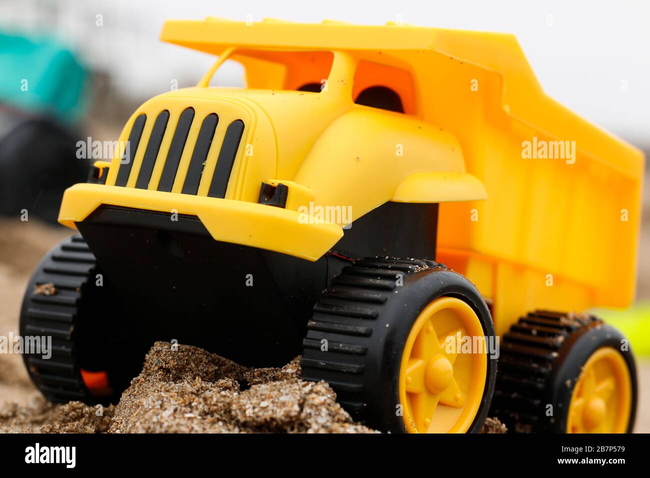 yellow toy truck on the sand Stock Photo Alamy