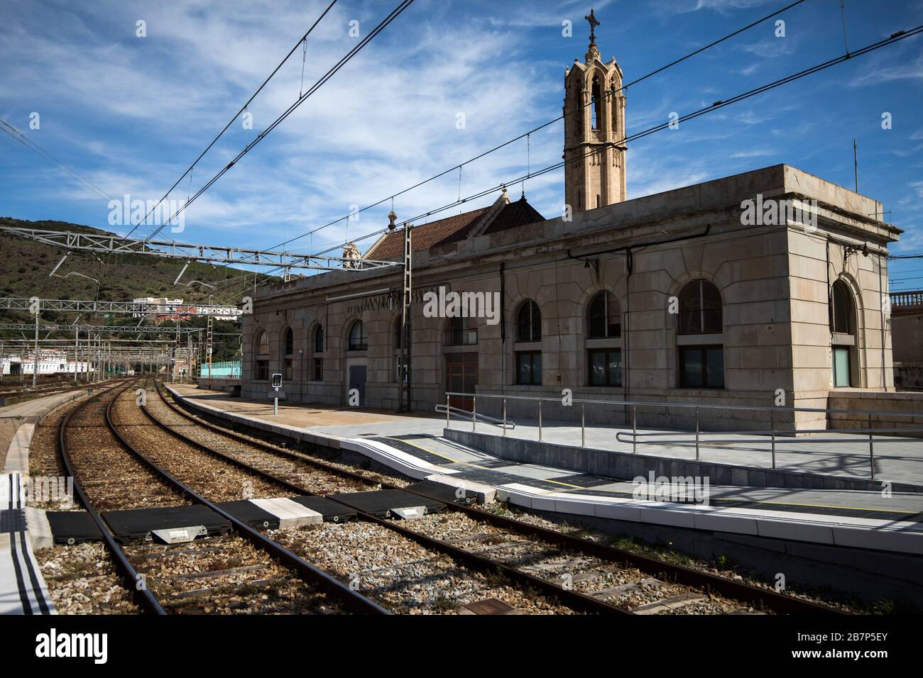 The church of Santa Maria de Potbou seen from inside the train station. Costa Brava, Girona, Spain. Stock Photo
