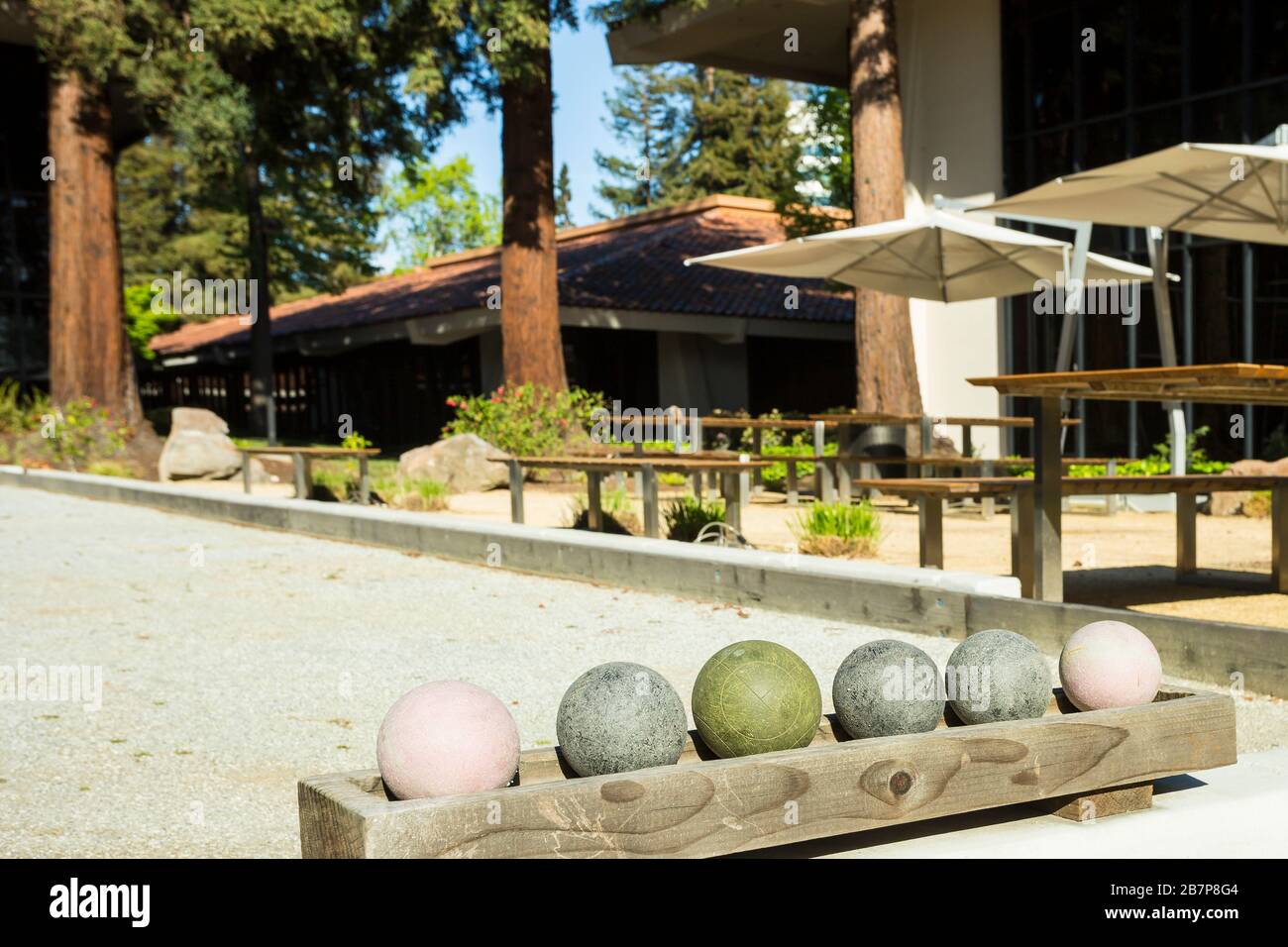 Bocce balls and court outside office buildings Stock Photo