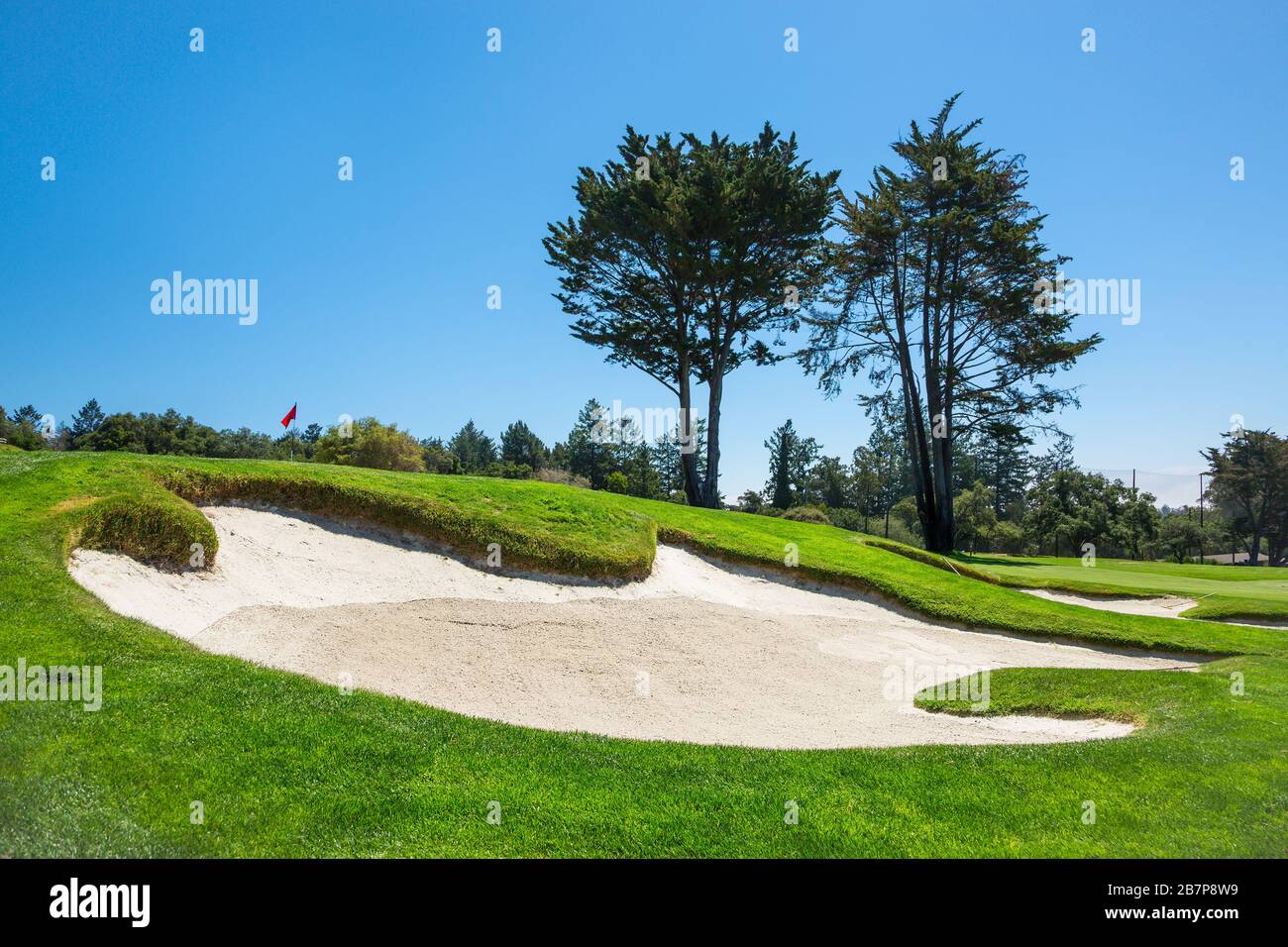 Sand bunker in a golf course Stock Photo