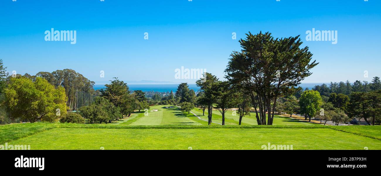 Panorama view of a beautiful golf course by the sea Stock Photo