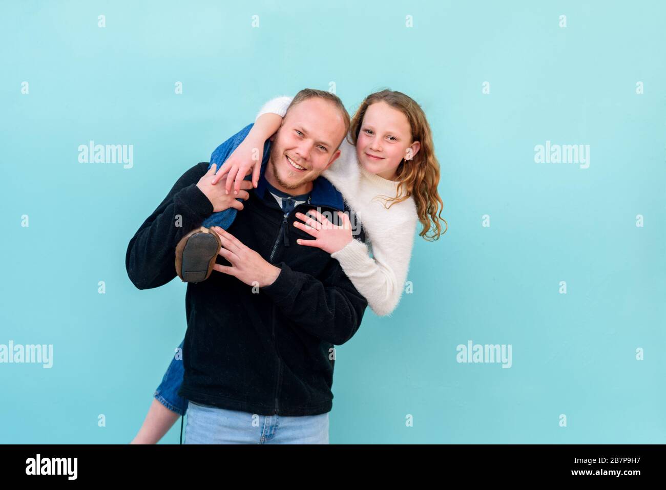 Boy Giving Piggyback Ride To Twin Sister Stock Photo - Image of game,  friend: 233593328