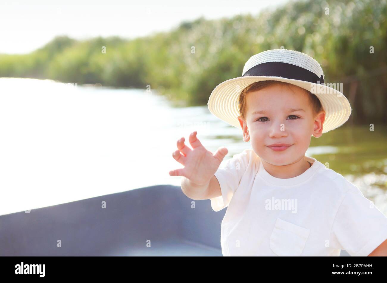 Happy boy and boat hi-res stock photography and images - Alamy