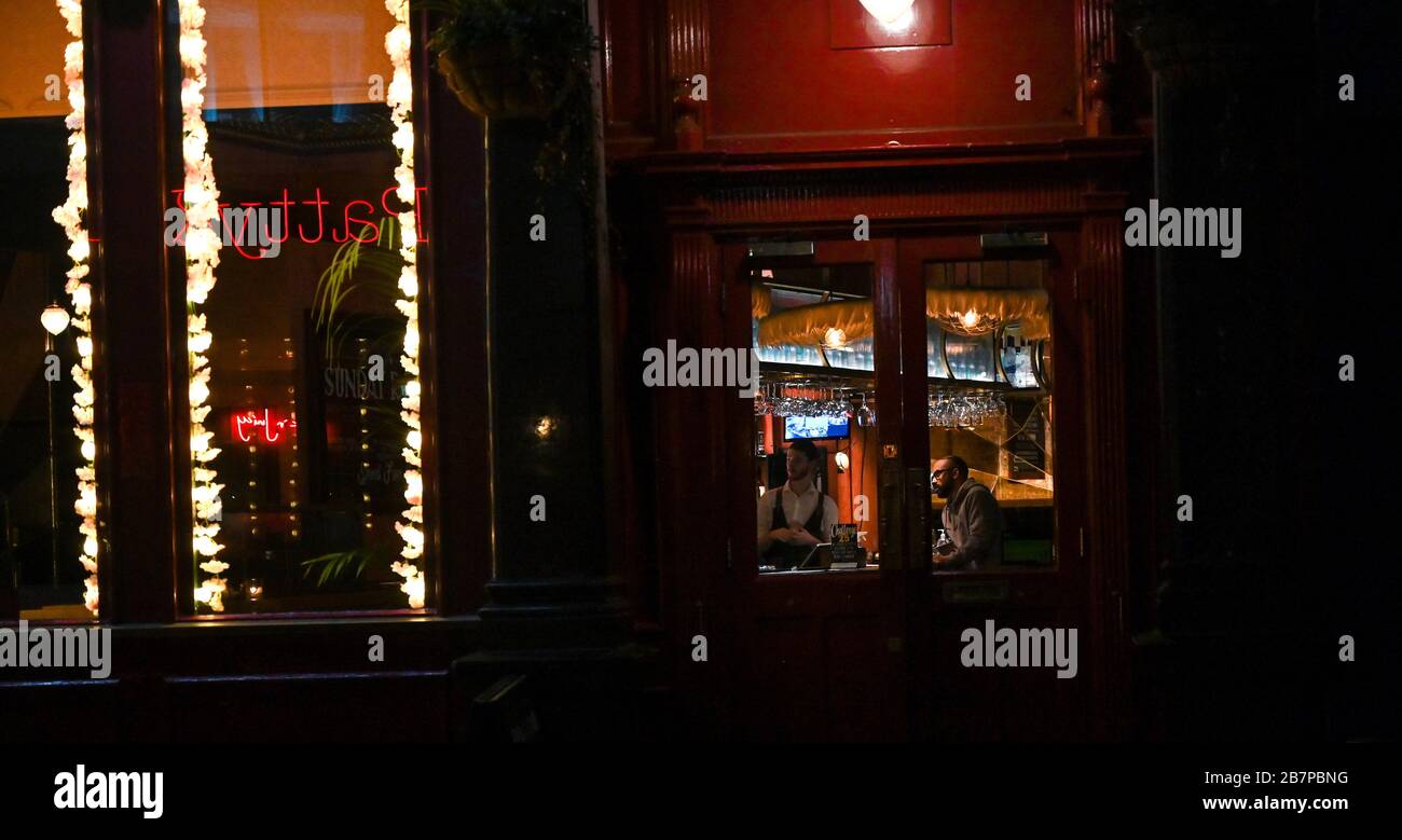Brighton UK 17th March 2020 - Restaurants bars and pubs are quiet this evening in the normally bustling Lanes area of Brighton due to Coronavirus COVID-19 crisis and the government asking people to stay at home as people have last drinks at The Seven Stars pub : Credit Simon Dack / Alamy Live News Stock Photo