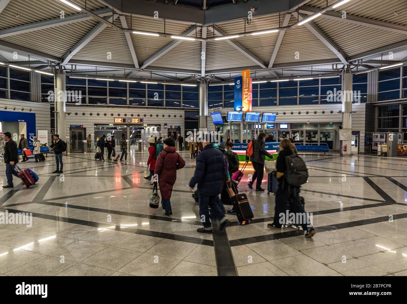 Athens Old Town, Attica/ Greece - 12 28 2019: Travellers walking through the transportation hub of the Athens Airport metro hall Stock Photo