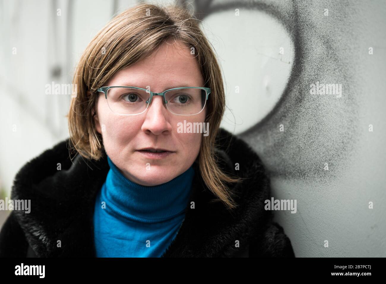 Portrait of a thirty year old attractive girl in a black winter coat Stock Photo