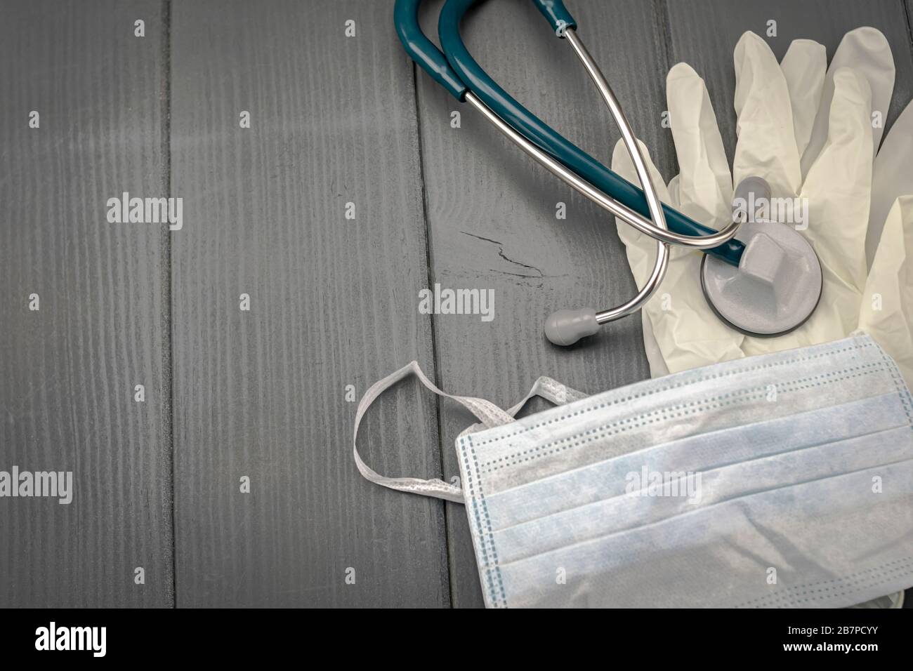 Individual protection equipment. Latex gloves, mask and stethoscope for medical use to detect viruses and bacteria Stock Photo