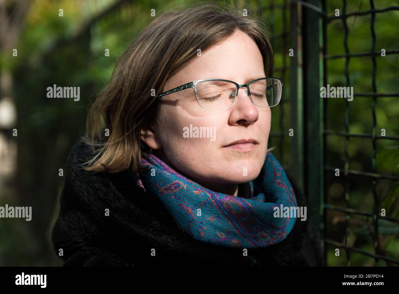 Portrait of a thirty year old attractive girl in a black winter coat Stock Photo
