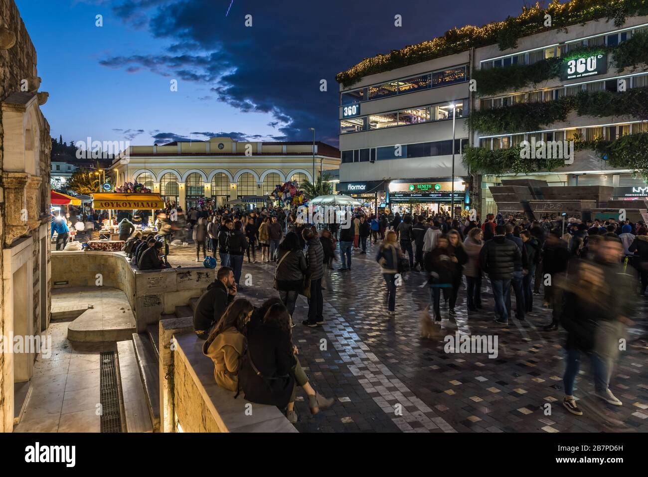 Tourists and locals walking at the Monastirakou square at a friday night in Athens, greece Stock Photo