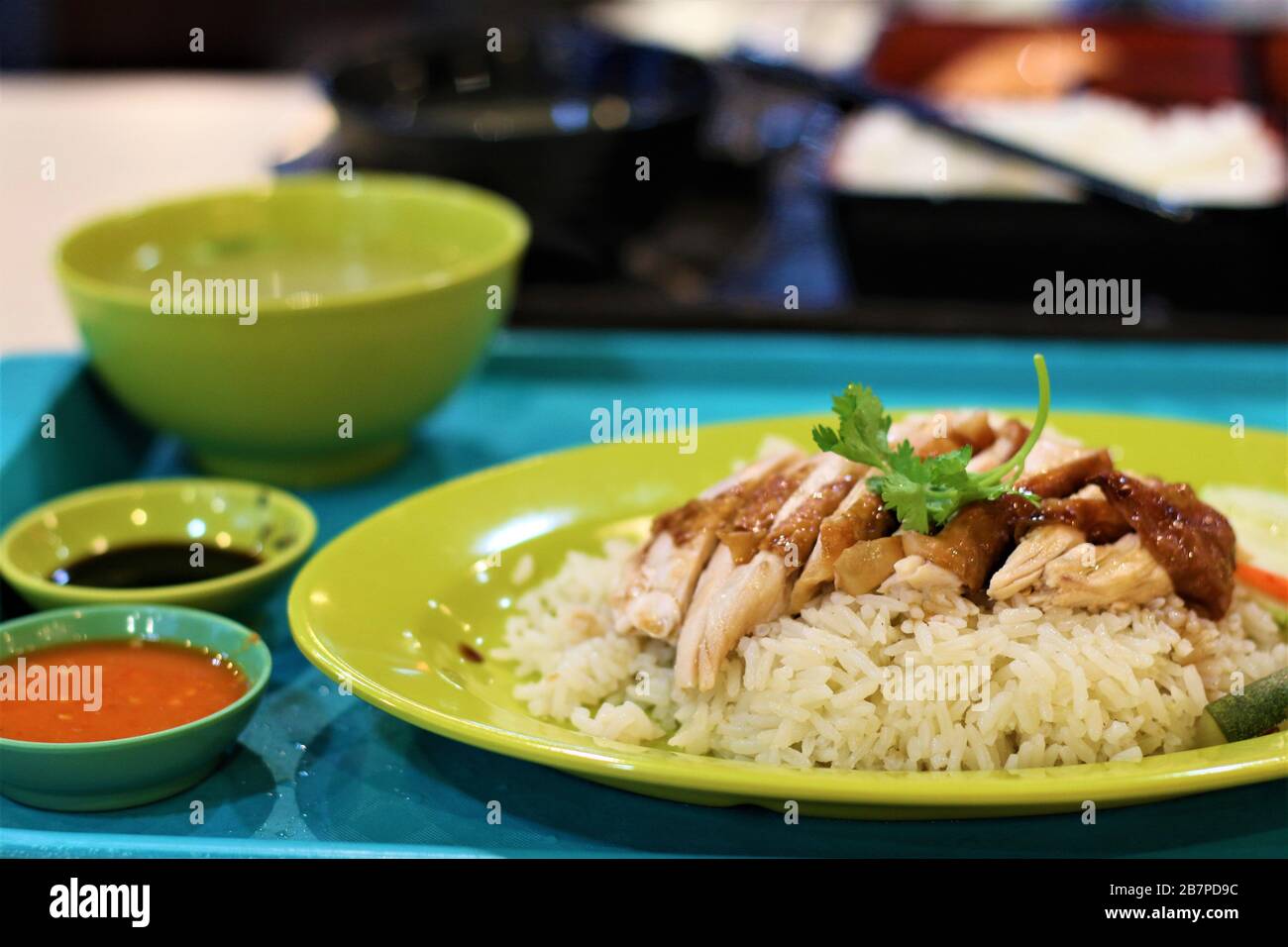 Authentic Delicious Singaporean Chicken Rice in a Hawker Food Court Stock Photo