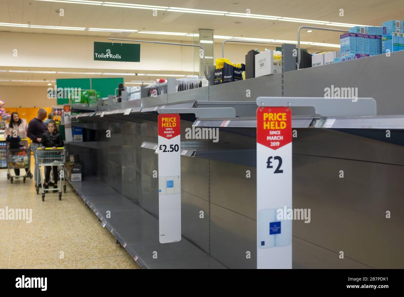 Coronavirus in the UK leads to mass panic buying of toilet rolls in supermarkets Stock Photo