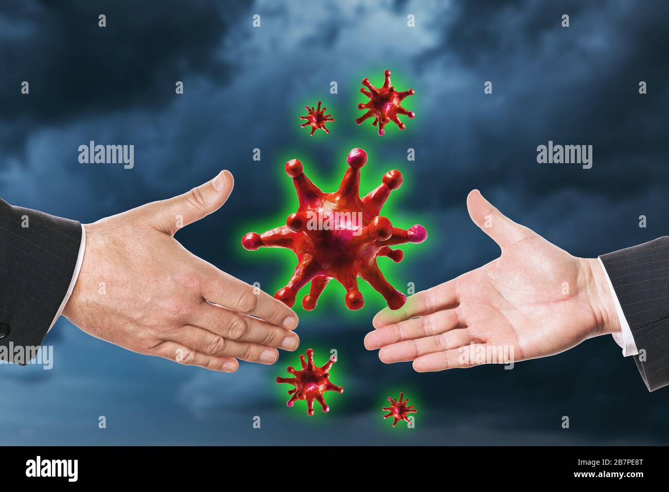 People shake hands on a background of a stormy sky. Shaking hands with