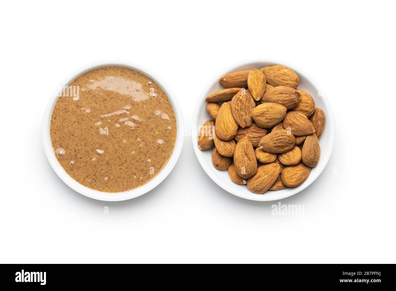 Almond spread. Almonds and butter isolated on white background Stock