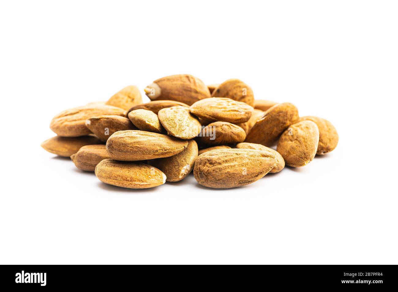Dried almonds nuts isolated on white background. Stock Photo