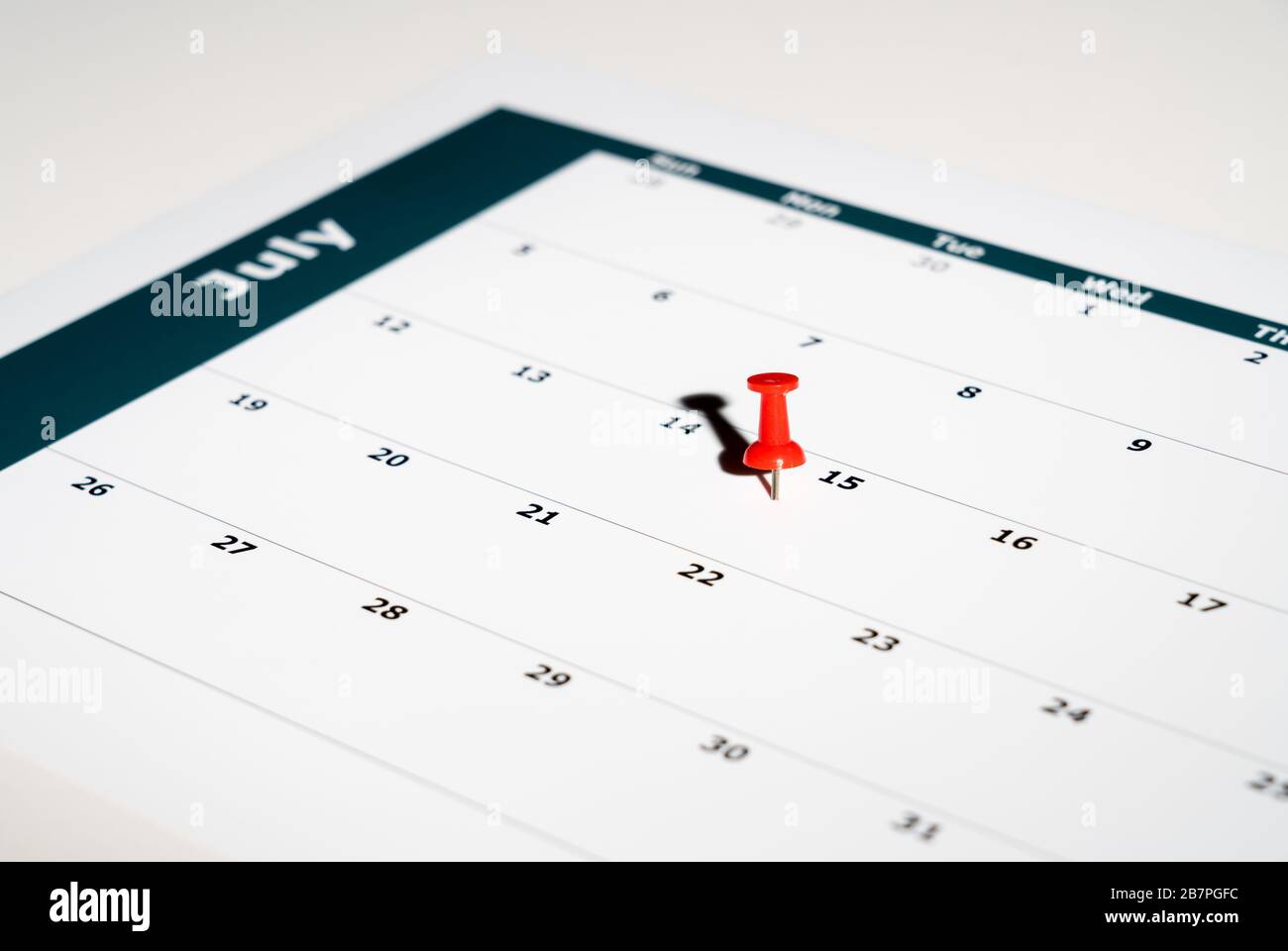 Reminder for sending income tax return for July 15 2020 tax day due to Covid-19 virus delay using calendar page and pin Stock Photo