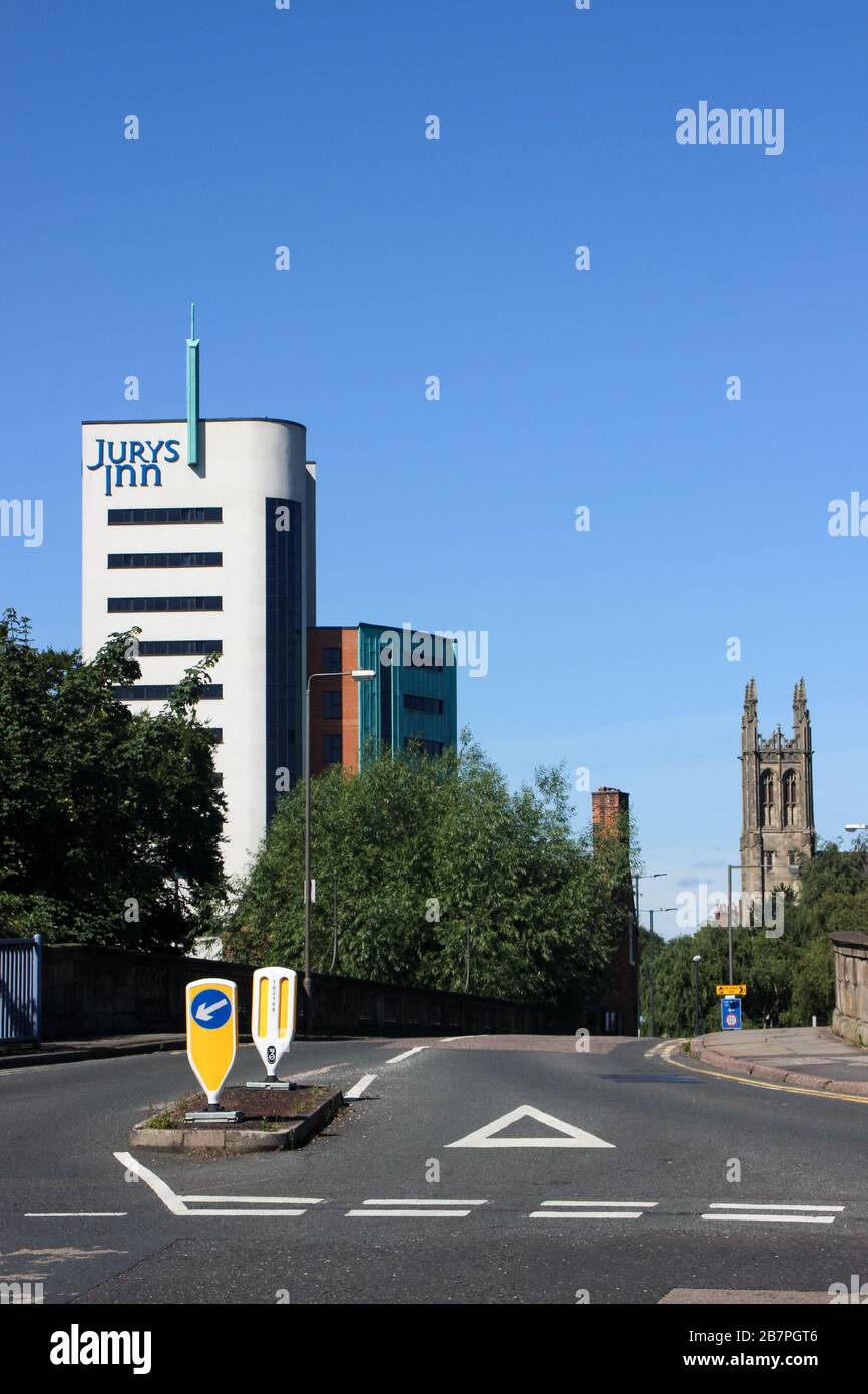Jurys Inn hotel on left with Derby Cathedral on right in Derby, England Stock Photo
