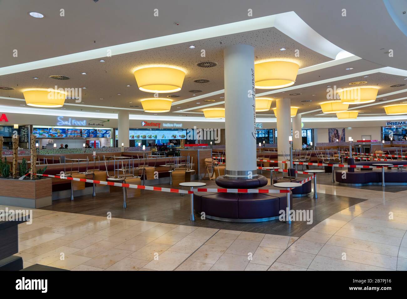 Effects of the coronavirus pandemic in Germany, Essen, Limbecker Platz shopping centre, cordoned-off areas, seating, dining tables for fast food resta Stock Photo