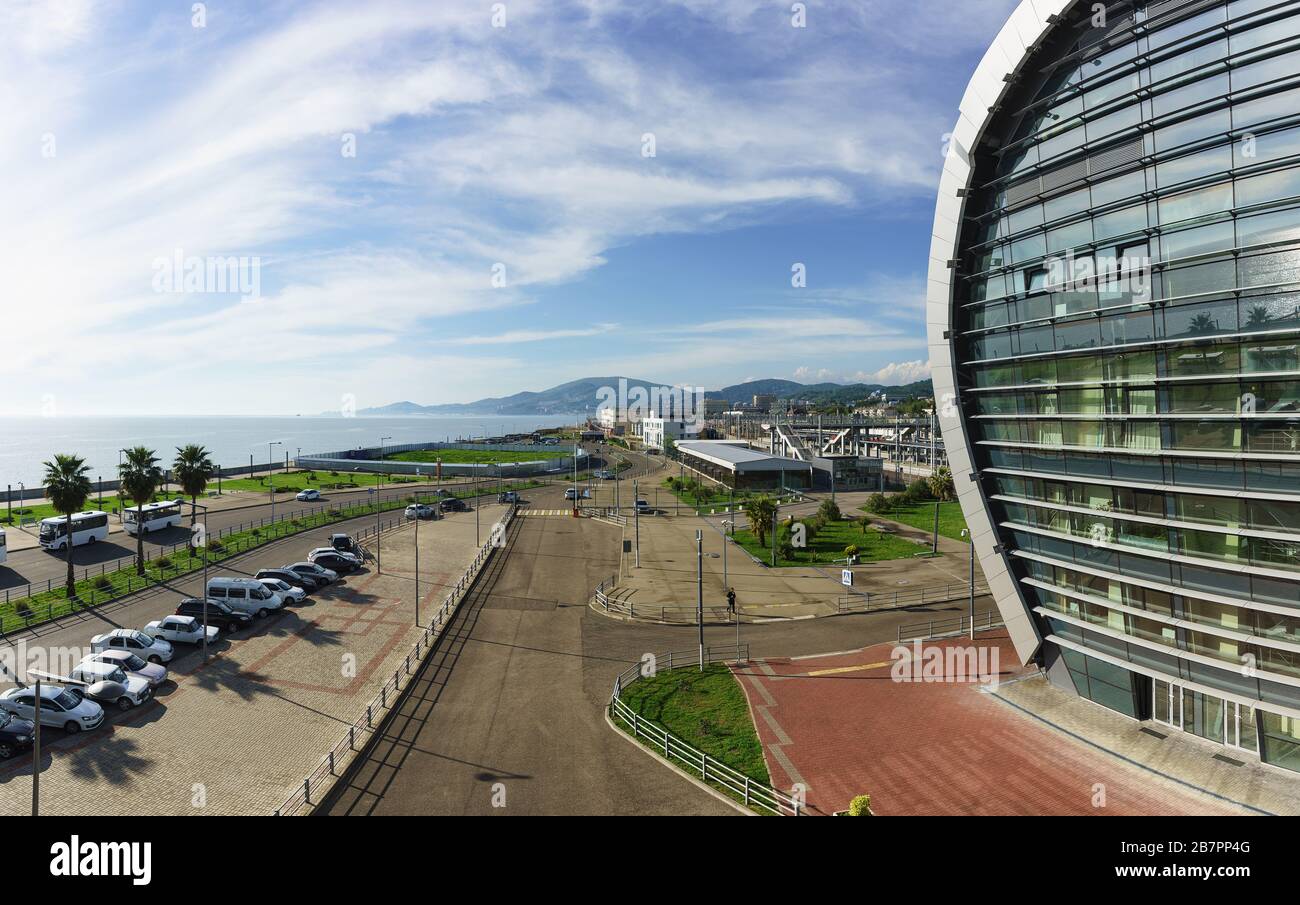 View of the city and the sea from the stairs of the modern passenger railway station. Sunny day in late spring Stock Photo