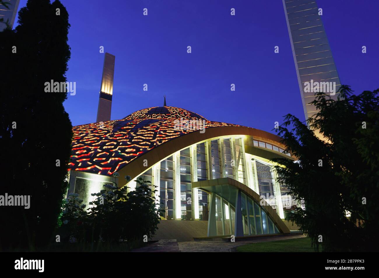 Evening illumination of the dome with the Islamic Crescent of the mosque named after aymani Kadyrova in the city of Argun of the Chechen Republic of t Stock Photo