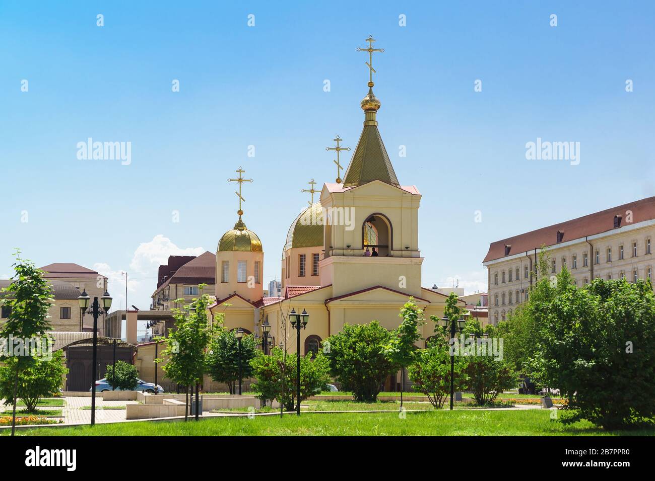 Domes of the Church of Archangel Michael on the Avenue named after Akhmat Kadyrov in Grozny. Christianity in a Muslim country Stock Photo