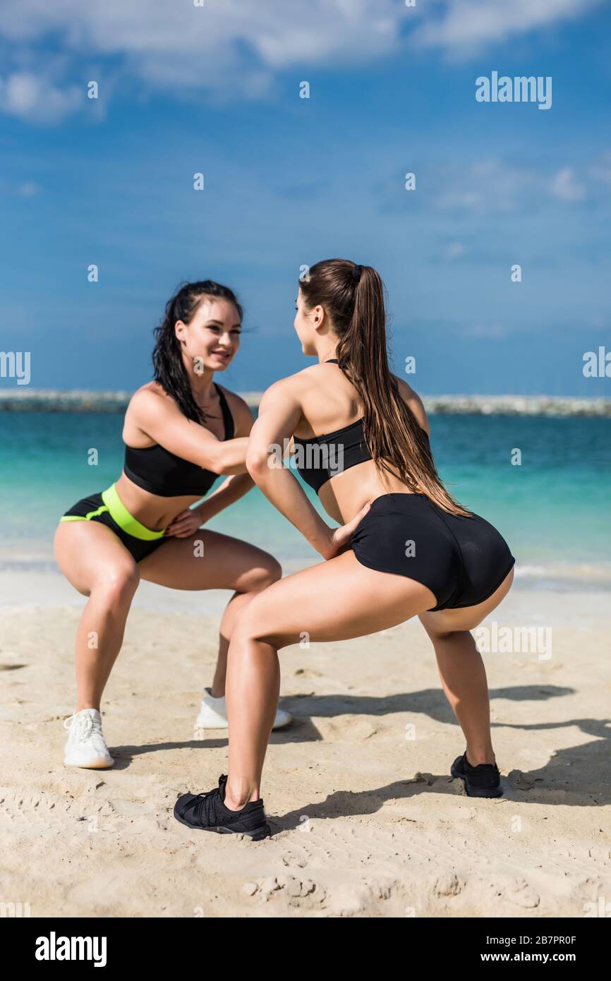 Girl squatting at beach hi-res stock photography and images - Page 2 - Alamy