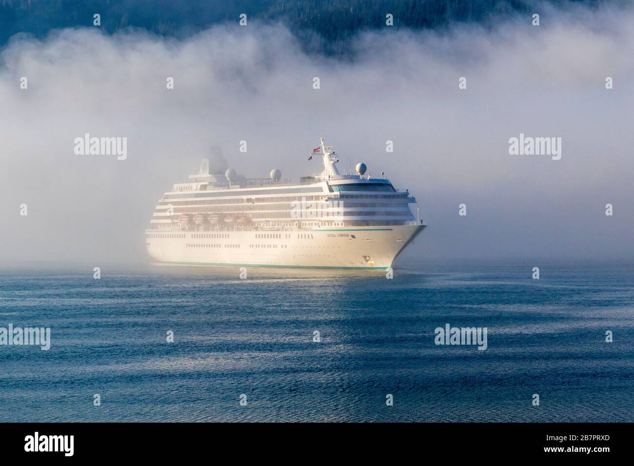 Crystal Symphony Cruise ship at Juneau, Alaska cruise ship terminal in fog and mist in early morning. Stock Photo