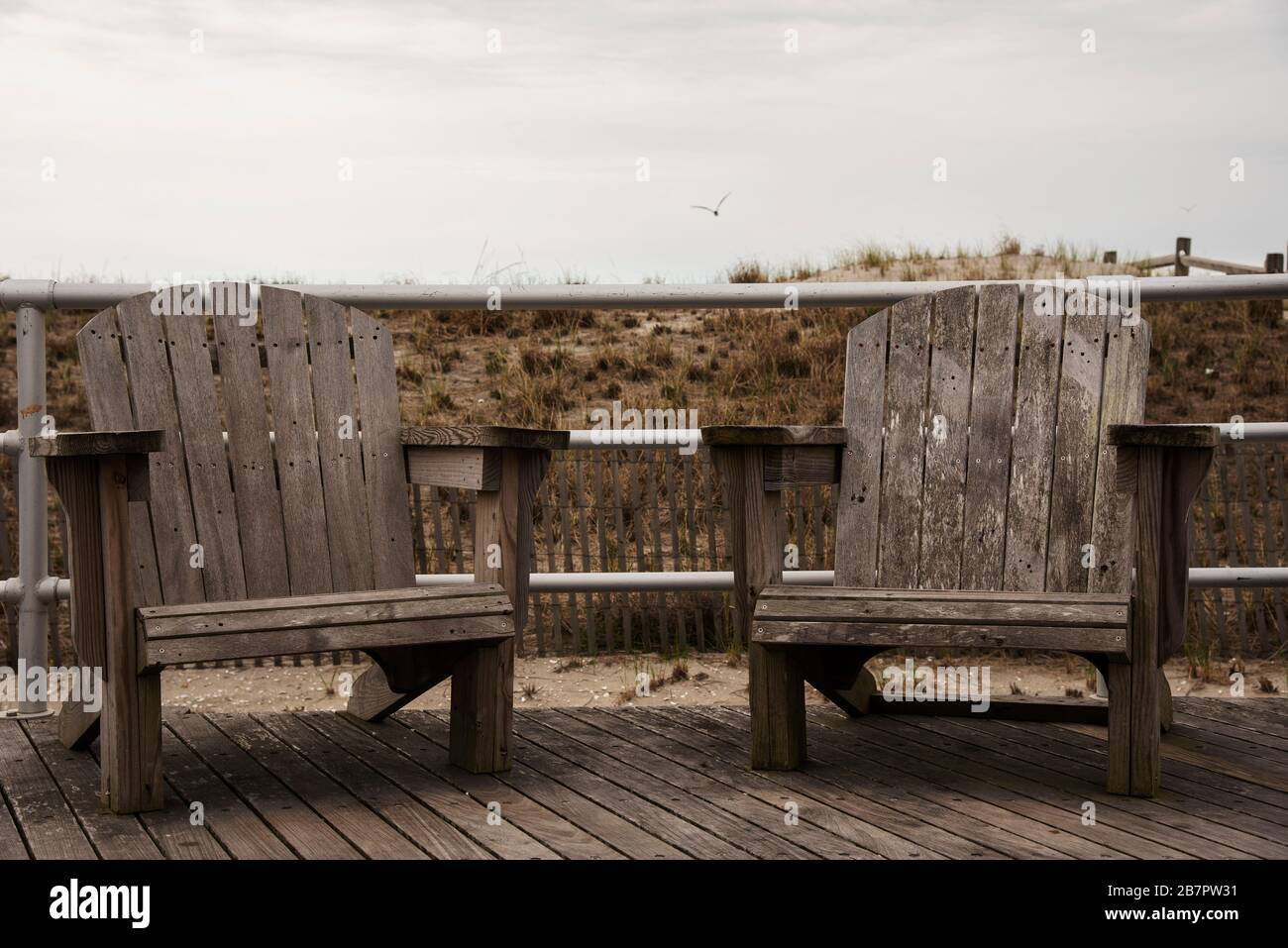 Two wooden chairs on Atlantic City Boardwalk Stock Photo Alamy
