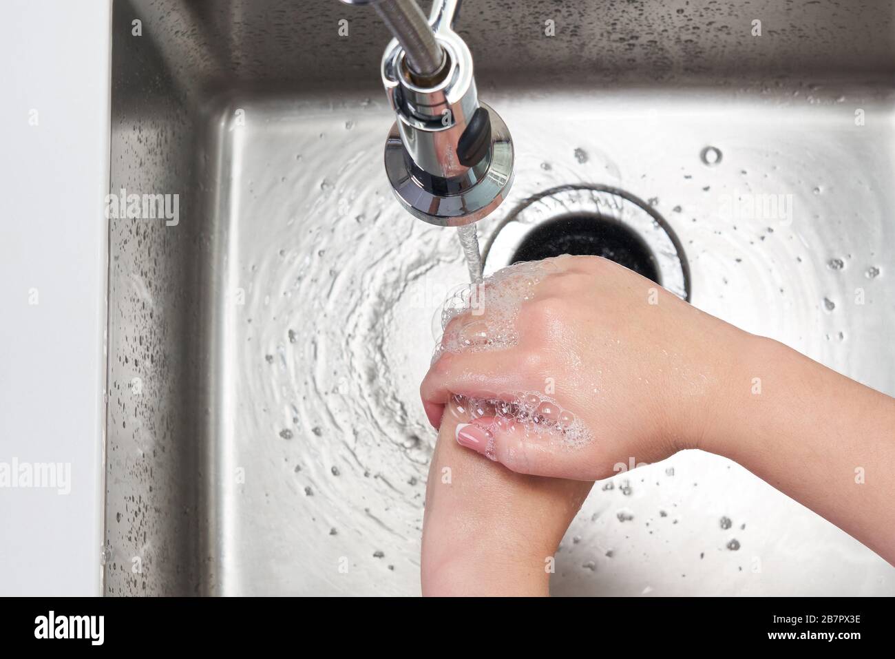 Woman washing hands with antibacterial soap for corona virus prevention ...