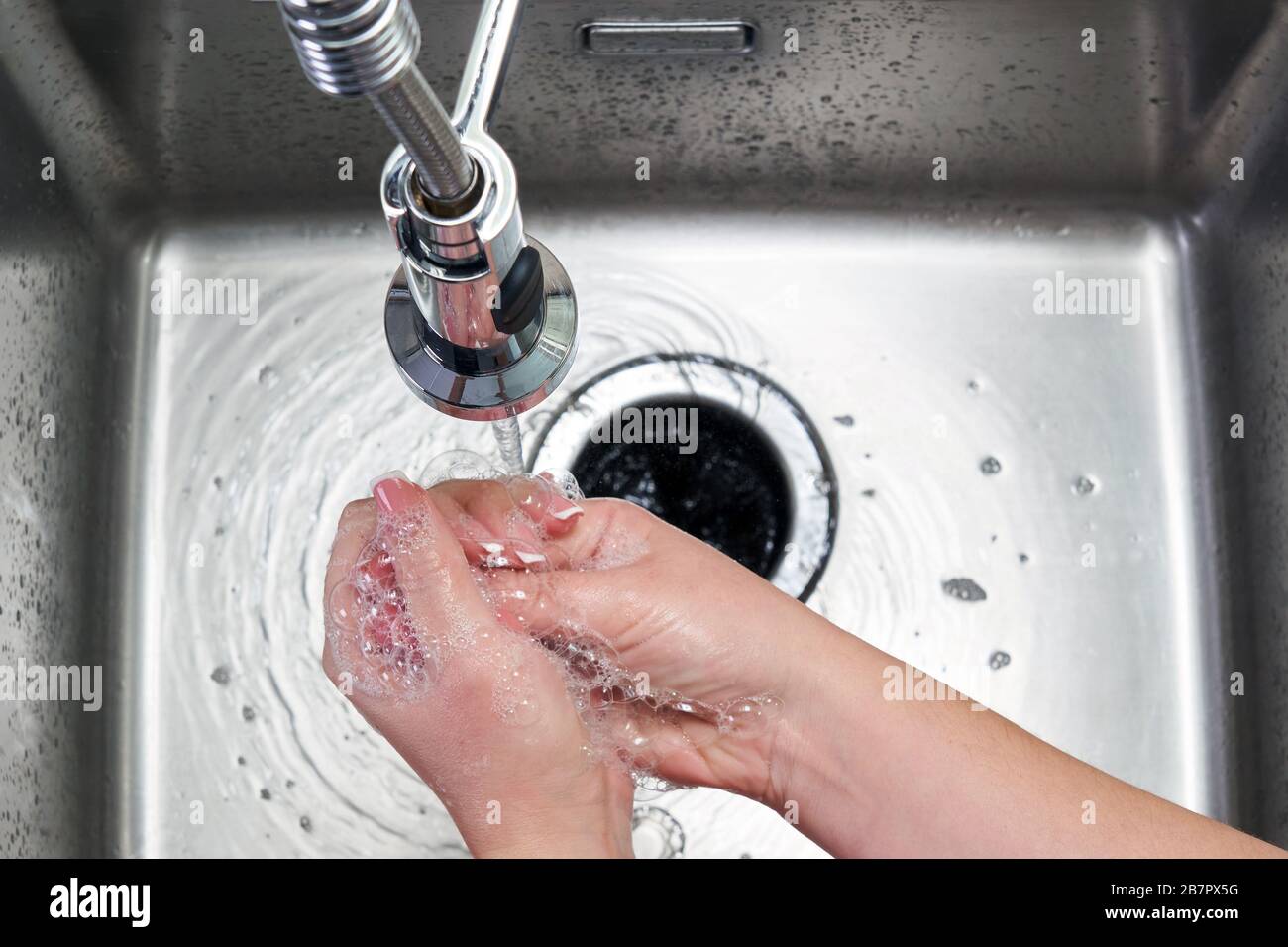 Woman washing hands with antibacterial soap for corona virus prevention ...